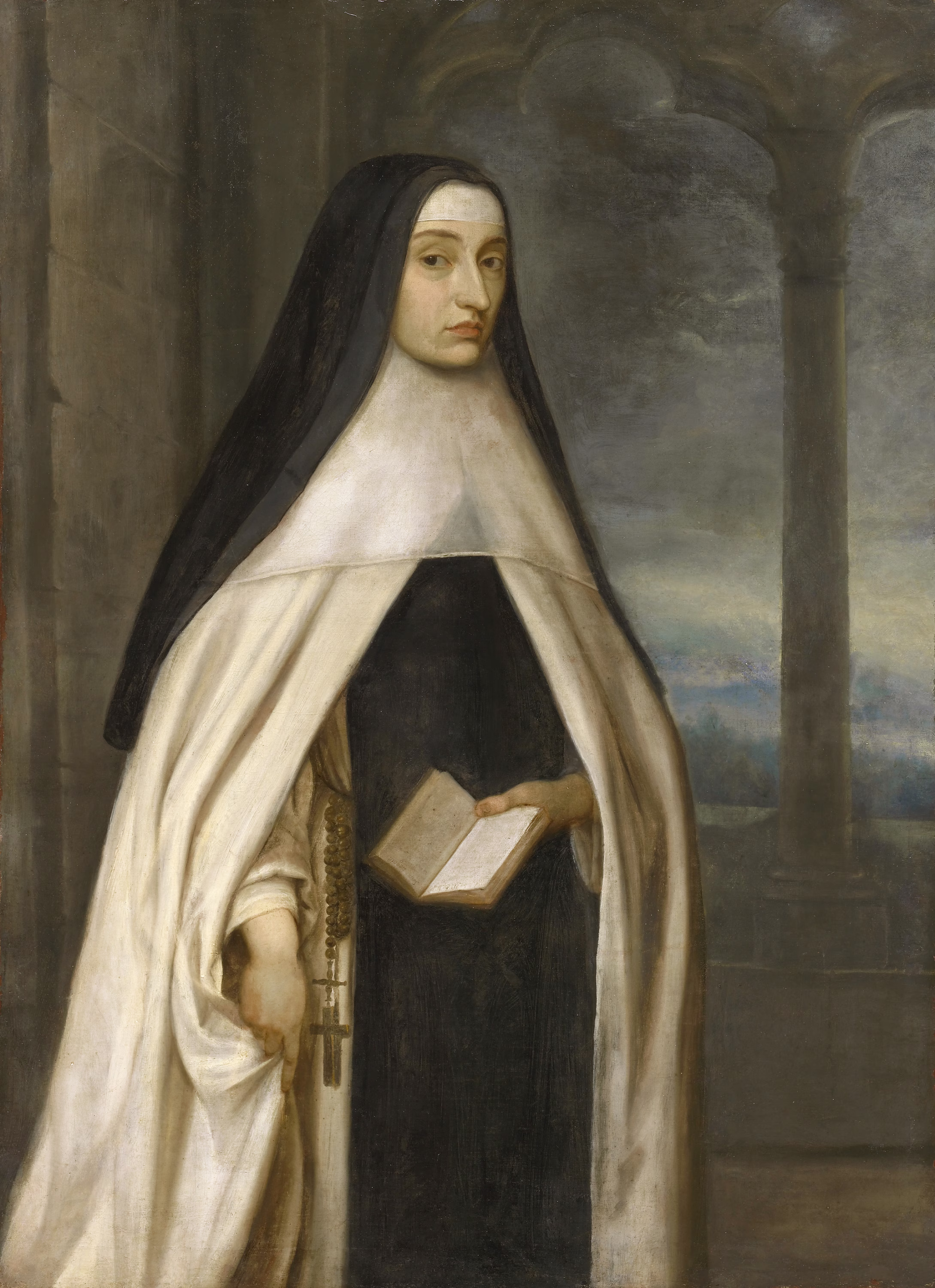 A woman wearing a black veil and white religious habit stands indoors, holding a book. The background shows stone columns and an arched window revealing a cloudy sky and distant landscape.