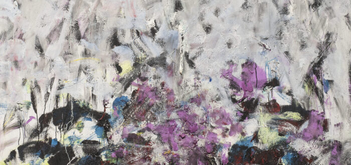 A vertical, abstraction features broadly painted strokes of pale gray, lavender, and cobalt in the upper two-thirds of the canvas. The colors continue in the lower third, along with touches of green, black, and other hues, but the expressive brushwork becomes denser and chaotic.