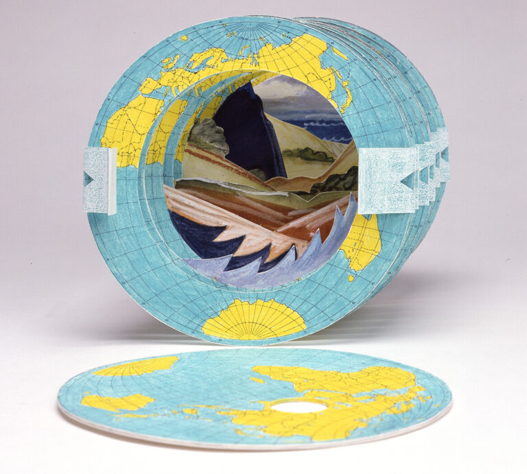 Multiple green and yellow paper globes are stacked on one another with a circular hole in the middle. Through the hole oceans, mountains, and trees are visible.