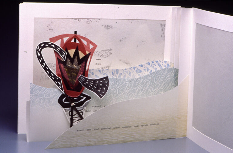 A pop-up book open to a page with a red and black abstract flower emerging, set against a background of white and blue swirling patterns and translucent paper layers.