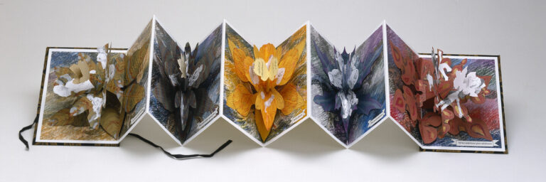 An accordion-style pop-up book is open, revealing six colorful, intricate 3D paper flower sculptures, each on a separate page, arranged in a row against a plain background.