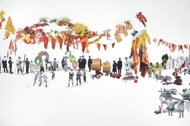 A long horizontal rectangle with small numerous figures and images collaged on the surface. Black and white figures in soldier’s uniforms stand and lay down, along with yellow and red banners, flags, and garlands.