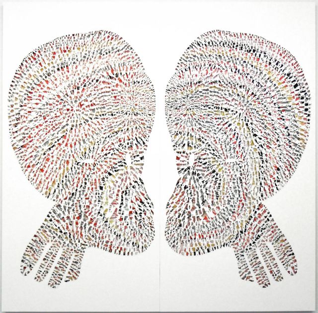 Two symmetrical forms that appear as heads with enlarged crania face each other. A colorful background for the heads peek through behind thousands of cut paper letters.