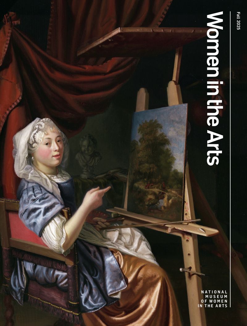 Cover of "Women in the Arts" magazine with a painting of a woman in historical clothing sitting at an easel, painting a landscape. She looks at the viewer, pointing at her artwork. The scene is set indoors with dark drapery and a shelf in the background.