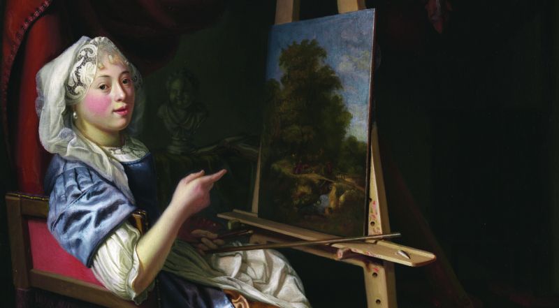 A woman in historical clothing sits at an easel, painting a landscape. She looks at the viewer, pointing at her artwork. The scene is set indoors with dark drapery and a shelf in the background.