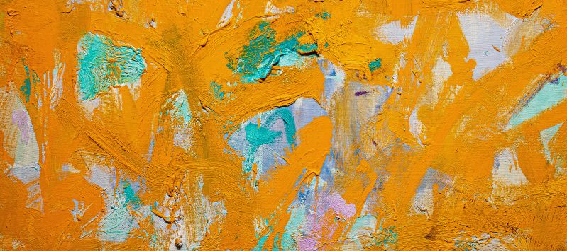 Close-up detail of an abstract painting with very thick and gestural brushstrokes of mostly orange paint.