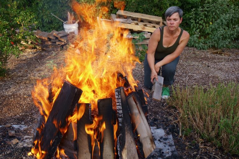 Jami Porter Lara firing clay at her home studio by Jami Porter Lara