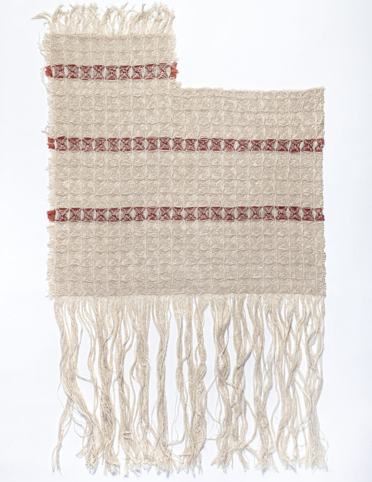 A white, linen dishtowel with three equidistantly parallel horizontal red stripes, frayed edges, and a missing rectangular section in the top right corner. The bottom has been mostly untangled and long, frayed threads hang loosely.