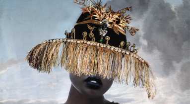 A person with dark skin tone in a black-and-gold ornate dress with gold chain details wears a wide-brimmed hat decorated with gold fringe and plants, obscuring their eyes. The background shows a cloudy sky.